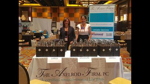 President Sheryl Axelrod and Partner Lisa Savitt at The Axelrod Firm's table, where they greeted fellow expo attendees and gave out gift bags containing awesome swag representing the firm